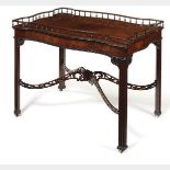 A FINE CHIPPENDALE PERIOD MAHOGANY TEA/CHINA TABLE The serpentine formed top with spindle gallery,