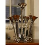 A LARGE SILVER PLATED EPERGNE Five trumpet vases on a scrolled frame. (approx 45cm)