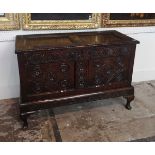 A 17TH CENTURY CARVED OAK TWO PANELLED COFFER On later stand. (108cm x 49cm x 75 m) Condition:
