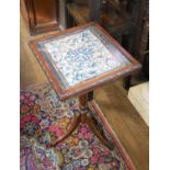A 19TH CENTURY MAHOGANY OCCASIONAL TABLE The glazed top inset with a Chinese embroidered rank badge.