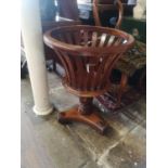 A REGENCY DESIGN MAHOGANY BASKET JARDINIÈRE Having a pierced frame and tripod base. (approx 67cm x