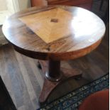 A 19TH CENTURY FRENCH ROSEWOOD SUPPER TABLE The inlaid circular top raised on a turn cannon barrel