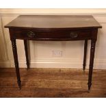 A 19TH CENTURY MAHOGANY HALL TABLE With a single bow fronted drawer, raised on ring turned lags with