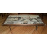 A 20TH CENTURY TILED TOP COFFEE TABLE Decorated with a Venetian river scene, raised on iron base. (h