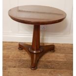 A 19TH CENTURY MAHOGANY CIRCULAR OCCASION TABLE Raised on tapering turned column standing on