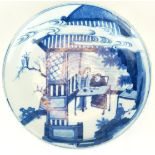 AN 18TH CENTURY CHINESE BLUE AND WHITE EXPORT DISH Hand painted with figures in a garden. (approx