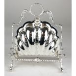 A SILVER PLATED SHELL FORM TABLE BISCUIT BOX. (25cm) Condition: good throughout