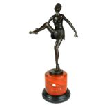 AN ART DECO STYLE BRONZE STATUE, SEMICLAD DANCING GIRL On a rouge marble plinth. (49cm) Condition: