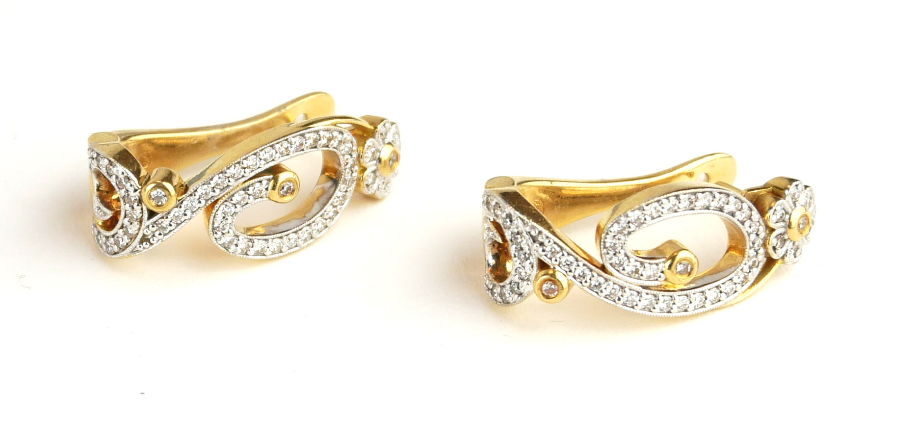 A PAIR OF 18CT GOLD AND DIAMOND EARRINGS Having a pavé set diamond scrolled design within a round