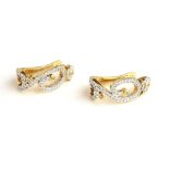 A PAIR OF 18CT GOLD AND DIAMOND EARRINGS Having a pavé set diamond scrolled design within a round