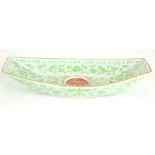 A CHINESE PORCELAIN SHALLOW 'BOAT' FORM DISH Having green lotus decoration and Qianlong blue