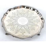 A VICTORIAN SILVER SALVER Having a scrolled beaded edge and engraved decoration with personal