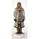 AN EARLY 20TH CENTURY SOVIET PORCELAIN STATUE, PEASANT GIRL Bearing impressed marks below. (18cm)