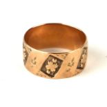 AN 19TH CENTURY GOLD RING Unmarked, decorated with four leaf clovers (size Q).