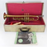 A VINTAGE SELMER BRASS TRUMPET With accessories and instruction book, cased.