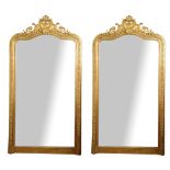A RARE PAIR OF LARGE 19TH CENTURY FRENCH GILT FRAMED MIRRORS Crested with shell and floral