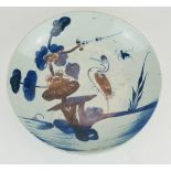 A CHINESE PORCELAIN CHARGER DISH Hand painted in underglaze blue and iron red palette with a stork