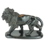 A MID 20TH CENTURY CONTINENTAL CAST METAL SPELTER MODEL OF A STANDING LION Bearing signature '