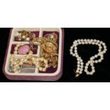 A 9CT GOLD AND CULTURED PEARL NECKLACE The single strand of pearls with spherical 9ct gold clasp,