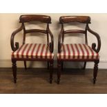 A PAIR OF WILLIAM IV MAHOGANY OPEN ARMCHAIRS With acanthus carved bar backs, scroll arms,