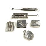 A COLLECTION OF GEORGIAN SILVER AND LATER TRINKETS Comprising a vinaigrette with embossed floral