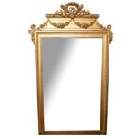 A 19TH CENTURY GILTWOOD FRAMED MIRROR Created with torches and floral swags above a silvered
