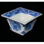 A CHINESE BLUE AND WHITE PORCELAIN SQUARE CUP Hand painted underglaze blue decoration of dragons and