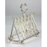 A STYLISH SILVER PLATED TOAST RACK IN THE FORM OF CRICKET BATS. (17cm) Condition: good throughout