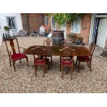 A REGENCY STYLE MAHOGANY 'D' END TWO PILLAR DINING TABLE With extra leaf, along with a matched set