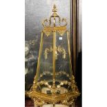 A LARGE POLISHED BRASS LANTERN The hexagonal tapering etched glazed panels above swags, shell and