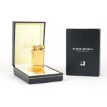 DUNHILL, A GOLD PLATED RECTANGULAR LIFT ARM UNIQUE WATCH LIGHTER With engine turned decoration,