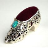 A STERLING FILIGREE SILVER AND OPAL PIN CUSHION IN THE FORM OF A SHOE. (5cm)