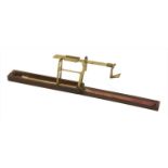 A rosewood cased brass single arm guinea scale,