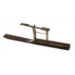 A mahogany cased brass folding coin scale,