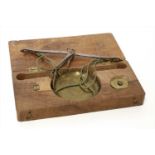 A walnut cased coin scale,