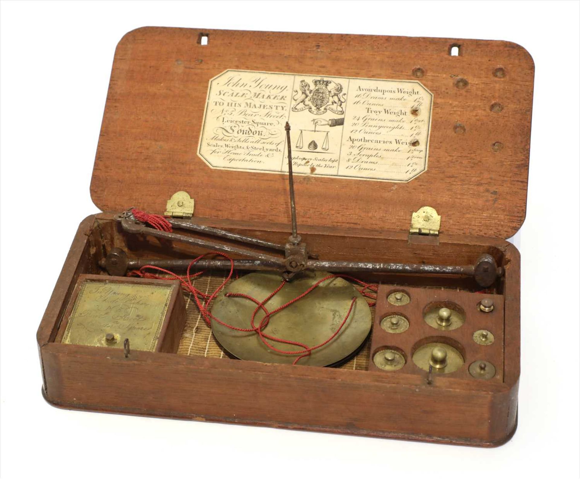 A mahogany cased coin scale,