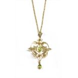 An Edwardian gold peridot and split pearl pendant,