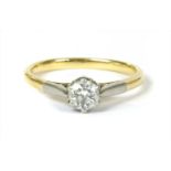 A gold single stone diamond ring,