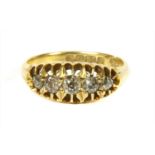 An 18ct gold boat shaped five stone diamond ring,