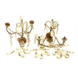 A pair of gilt bronze twin branch floral wall lights,
