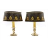 A pair of silvered table lamps,