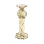 An alabaster pedestal,