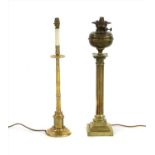 A brass column oil lamp,