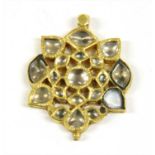 An Indian gold paste set pendant,