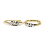 A gold three stone diamond ring,