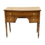 A Regency bow front dressing table