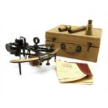 A black metal and brass ship's sextant,