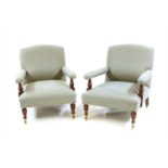 A pair of Howard & Son style armchairs,