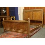 A French walnut double bedstead,