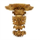 A carved and gilt wall bracket,